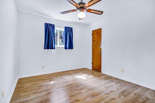 298 Jenkins Rd, Cedar Creek, TX 78612 - spare room featuring wood finished floors, a ceiling fan, and baseboards