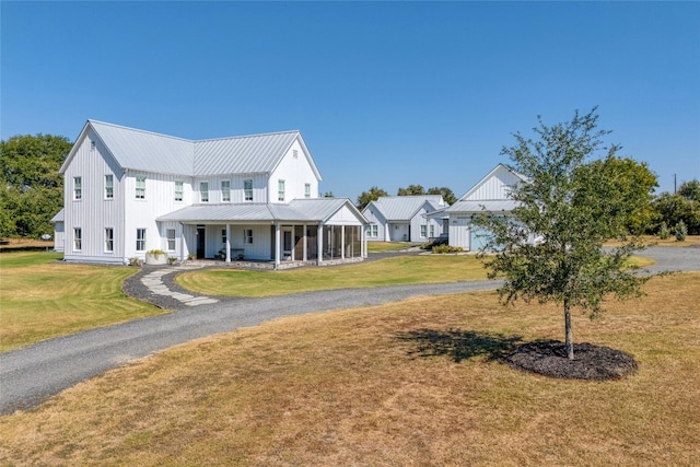 view of front facade featuring a front yard and a porch