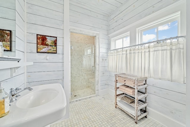 bathroom featuring wood walls, walk in shower, and tile patterned floors