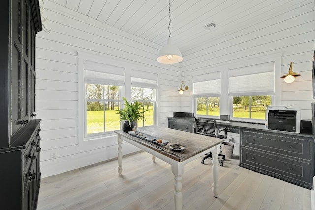 233 W Mill St, Round Top, TX 78954 - office featuring wood walls and wood finished floors