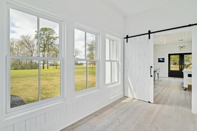 233 W Mill St, Round Top, TX 78954 - unfurnished sunroom featuring a barn door