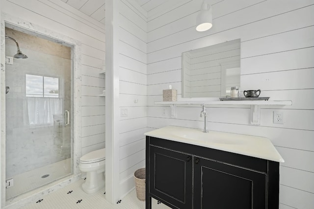 233 W Mill St, Round Top, TX 78954 - bathroom featuring a stall shower, toilet, vanity, wooden walls, and tile patterned floors