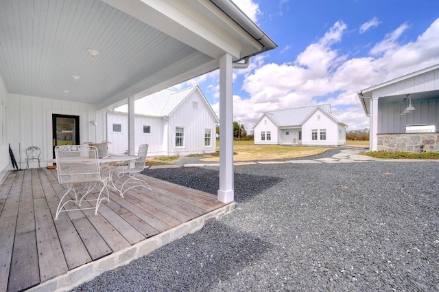 233 W Mill St, Round Top, TX 78954 - wooden terrace with outdoor dining space