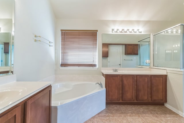 bathroom featuring vanity, tile patterned floors, and shower with separate bathtub