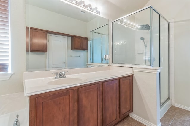 bathroom featuring vanity, tile patterned flooring, and an enclosed shower