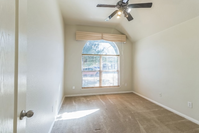 unfurnished room with carpet floors, ceiling fan, and vaulted ceiling