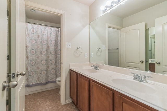 full bathroom featuring vanity, shower / tub combo with curtain, toilet, and tile patterned floors