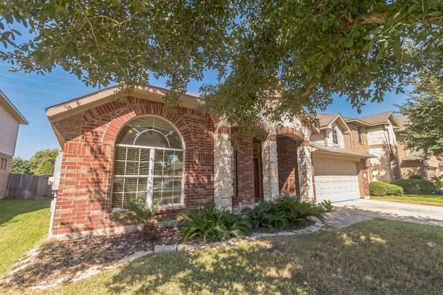 view of front facade featuring a front yard and a garage