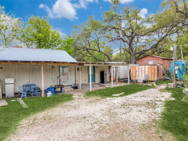 exterior space featuring a storage unit