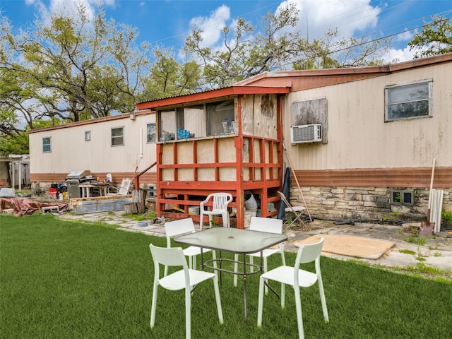 rear view of property with a patio area and a lawn