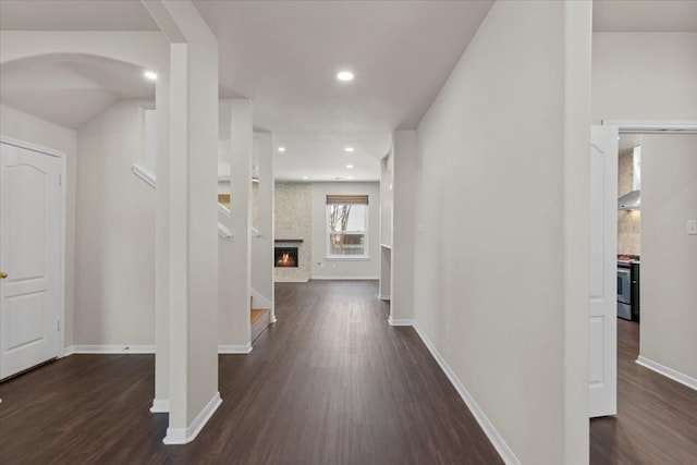 corridor with dark hardwood / wood-style flooring