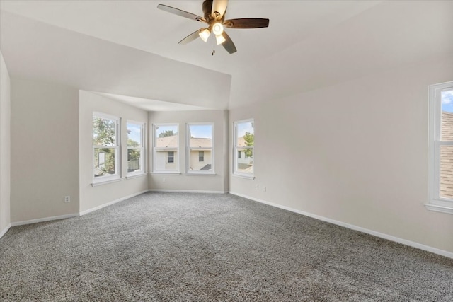 spare room with ceiling fan, carpet, and a wealth of natural light