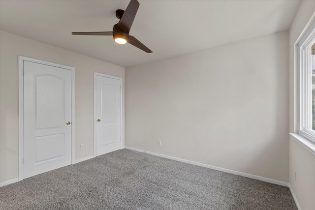 unfurnished bedroom featuring carpet and ceiling fan