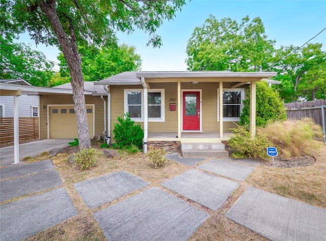 view of front of house with a porch and a garage