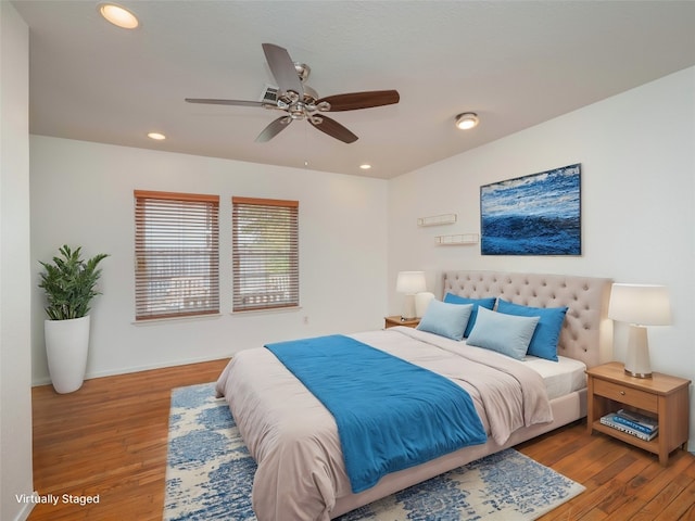 bedroom featuring ceiling fan and hardwood / wood-style flooring