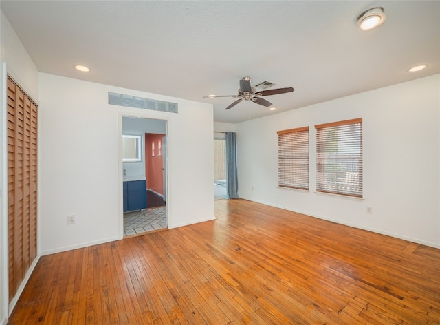 interior space with light wood-type flooring and ceiling fan