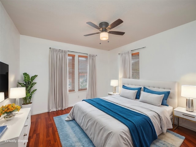 bedroom featuring dark wood-type flooring and ceiling fan