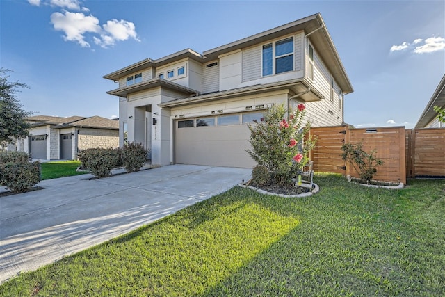 view of front of home with a front yard and a garage