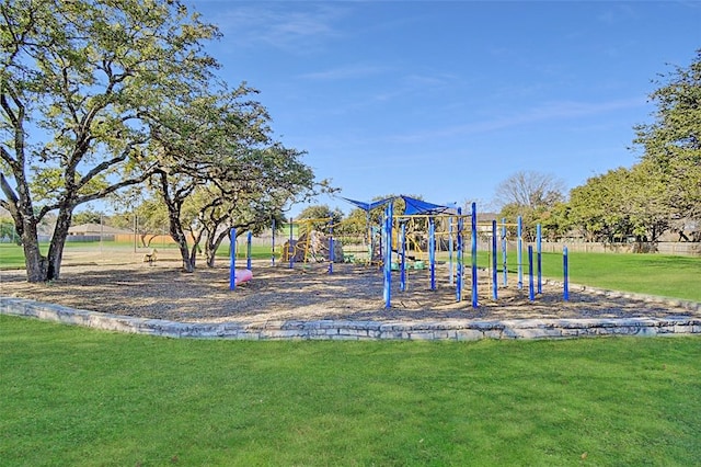 view of jungle gym featuring a lawn