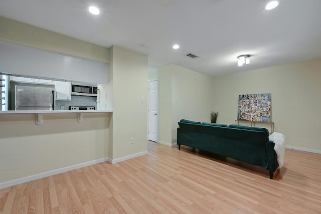 interior space with light hardwood / wood-style flooring