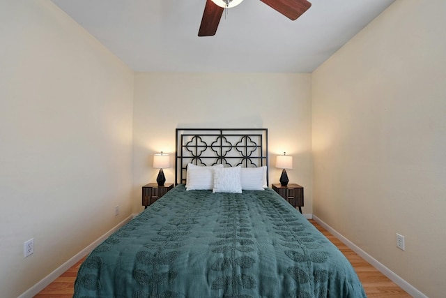 bedroom with light wood-type flooring and ceiling fan