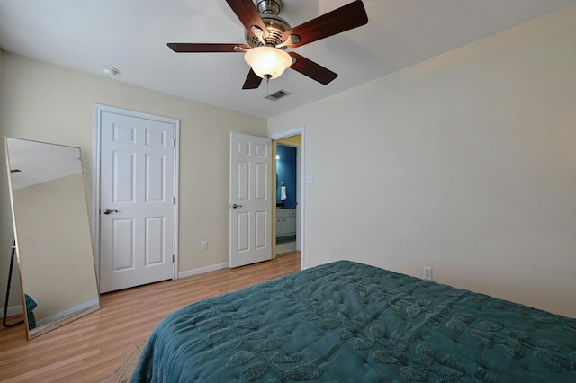 bedroom with light wood-type flooring and ceiling fan