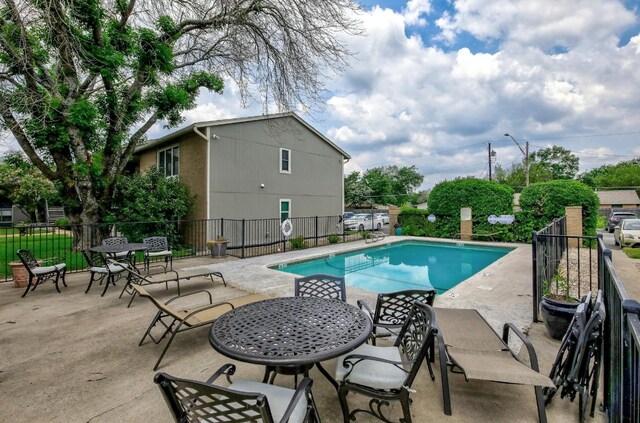 view of swimming pool featuring a patio area