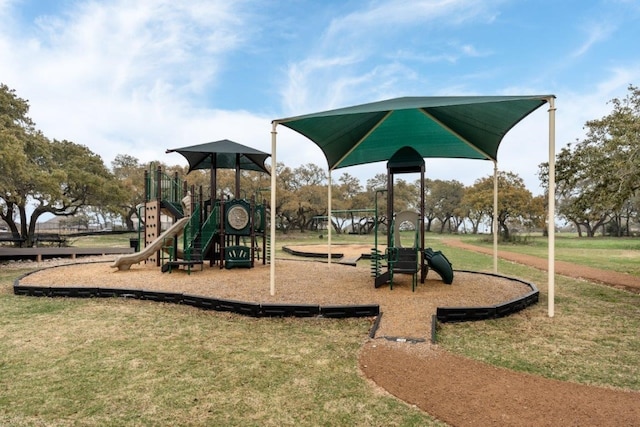 community jungle gym featuring a lawn