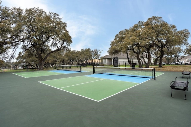 view of tennis court with fence