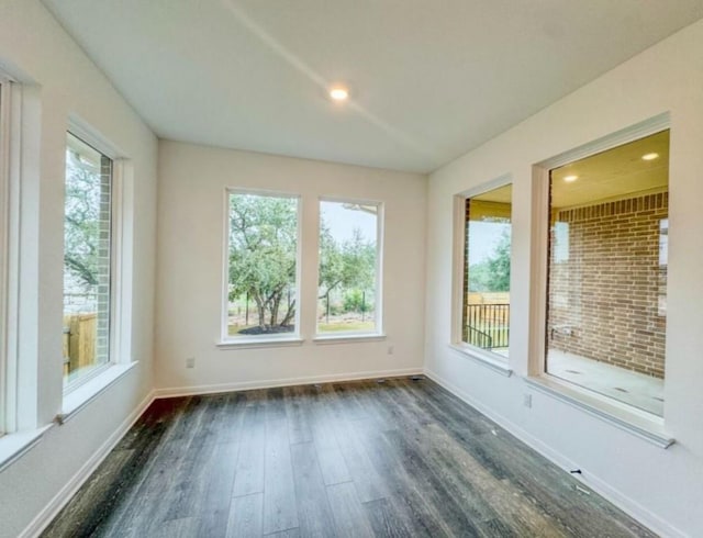 unfurnished sunroom featuring plenty of natural light