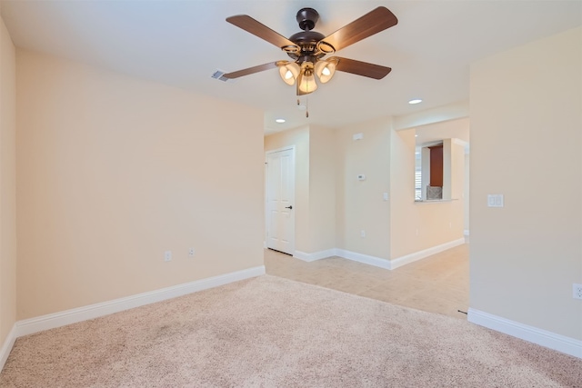 carpeted empty room featuring ceiling fan