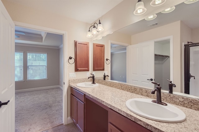 bathroom with vanity and ornamental molding