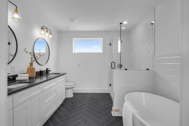 full bathroom with vanity, toilet, tile patterned flooring, and plus walk in shower