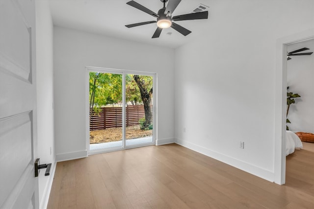 spare room with light hardwood / wood-style flooring and ceiling fan