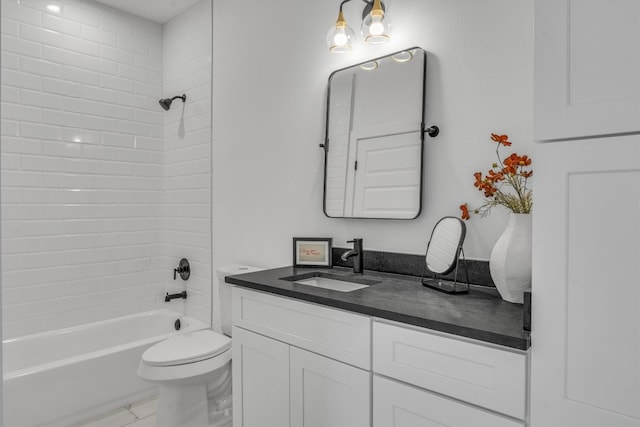 full bathroom featuring vanity, toilet, and tiled shower / bath