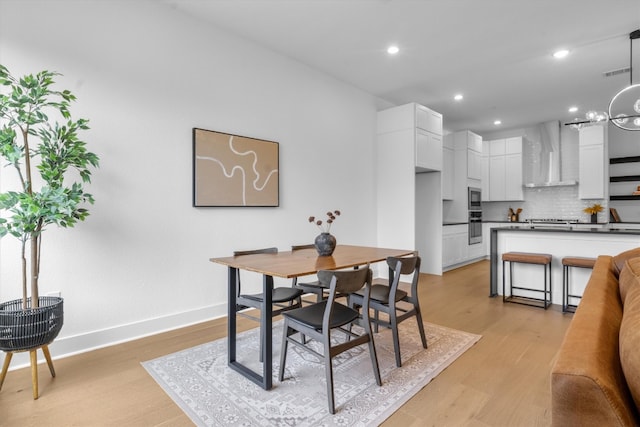 dining room with light wood-type flooring