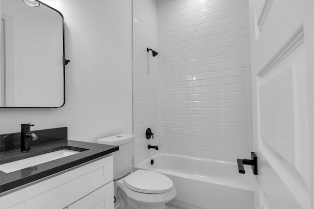 full bathroom with toilet, tiled shower / bath combo, and vanity