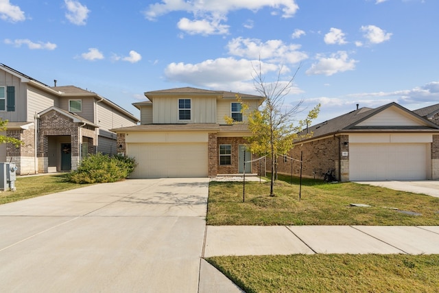 view of front of home featuring a garage and a front yard