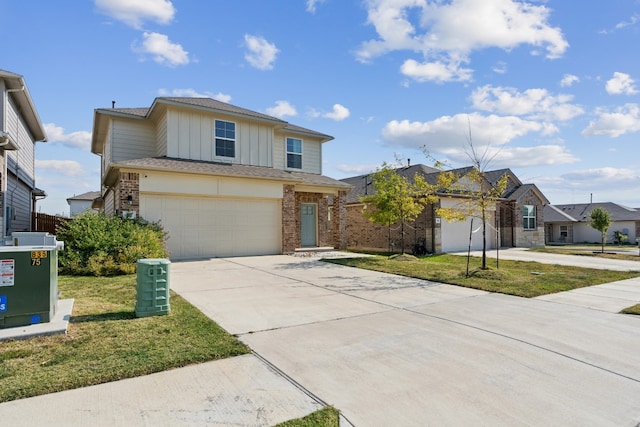 front of property featuring a front lawn and a garage