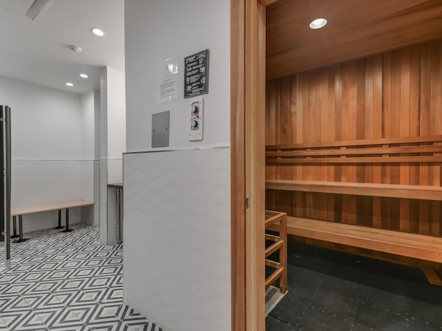 view of sauna with wooden walls