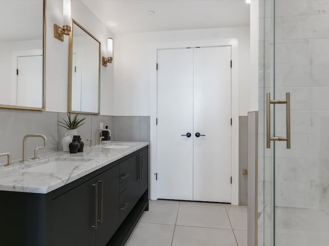 bathroom featuring vanity, tile patterned floors, and an enclosed shower