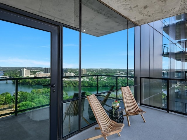 balcony featuring a water view