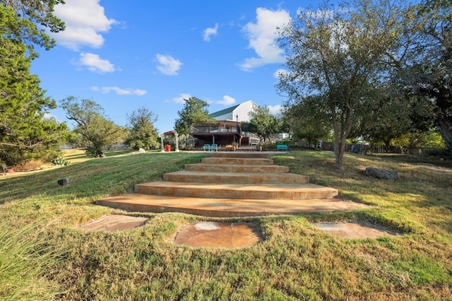 view of home's community with a lawn