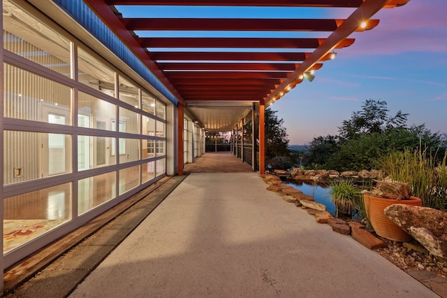 view of patio terrace at dusk