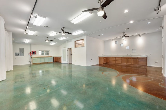 garage featuring visible vents, ceiling fan, and baseboards