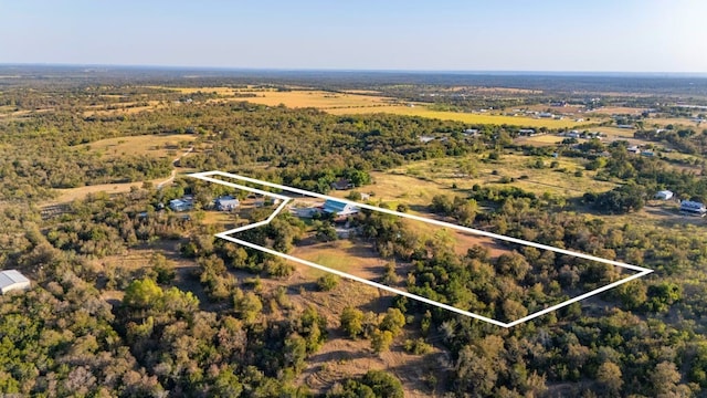 TBD Hibbs Lane, Manor, TX 78653 - birds eye view of property featuring a wooded view