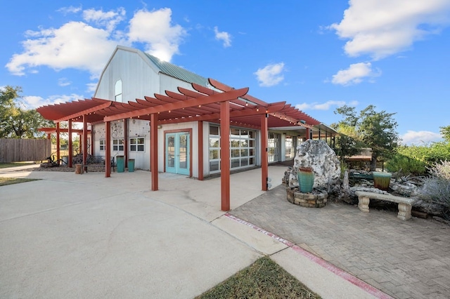 view of patio / terrace featuring a pergola and french doors