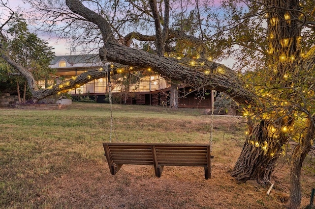 view of home's community with a yard