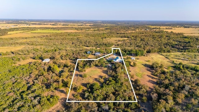 aerial view featuring a wooded view