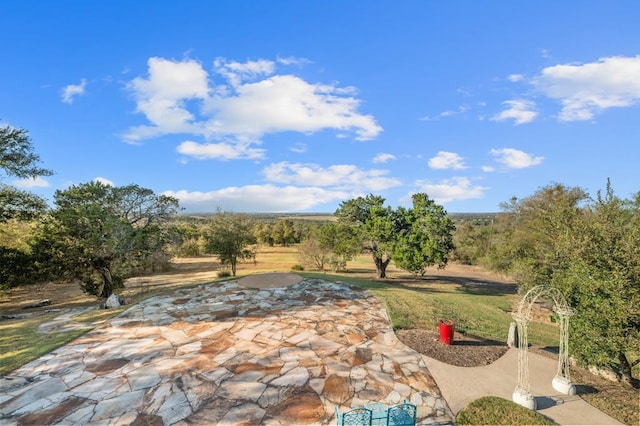 view of patio / terrace featuring a rural view